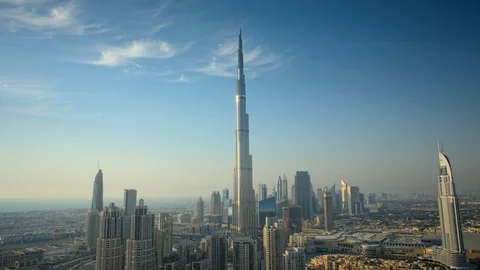 Pan down Burj Khalifa while tracking left over Business Bay at 150m. Stock Footage 98944438