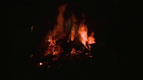 Pan down to burning bonfire Stock Footage 75243629