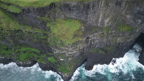 Pan down of Cliffs of Moher and waves 스톡 동영상 331960718
