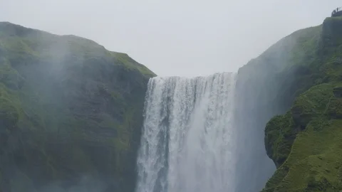 Pan down closeup of Skógafoss waterfall Stock Footage 127546193