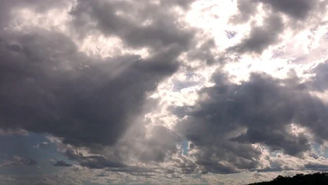 Pan down from clouds to show people on f... | Stock Video | Pond5
