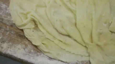 Pan down dough with holes Stock Footage 9443868