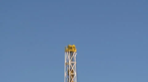 Pan down from drill at a fracking operation site Stock Footage 47939941