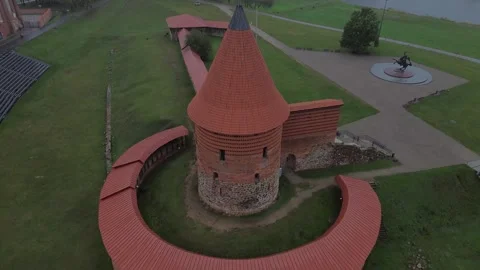 A pan down drone shot of the Kaunas castle in overcast weather Stock Footage 254085148