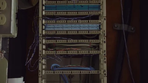A pan down of an electrical, phone, network cable box. Stock Footage 72295615