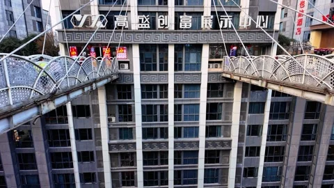 Pan down from Kuixing Tower pedestrian bridge revealing multilevel street Stock Footage 336466273