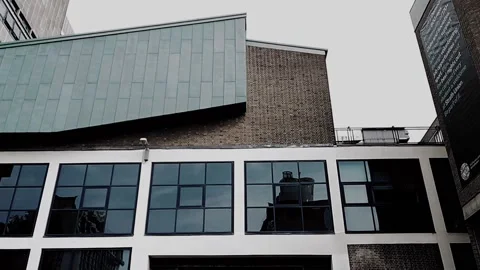 Pan down on large opening sealed with a metal shutter Video stock 160220462