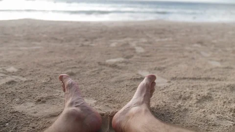 Pan Down to Up of Man's Feet on Brown Sand Beach in Akumal, Mexico Vídeo Stock 90585549