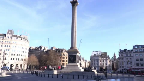 A pan down from Nelson statue to an empty Trafalgar Square during lockdown Video stock 142742242