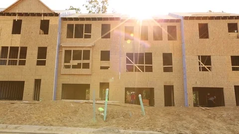 Pan down of new townhome construction Stock Footage 81749478