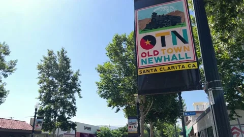 Pan down from Old Town Newhall Sign to street corner Stock-Footage 201747178