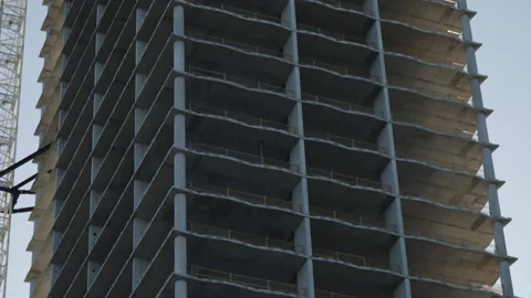 Pan down partially built skyscraper under construction Stock-Footage 204057961