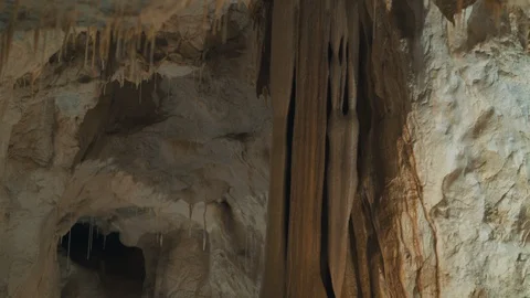Pan down of a rock formation inside a cave Stock Footage 94958066