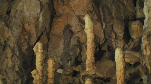 Pan down of a rock formations inside a cave Stock Footage 94957059