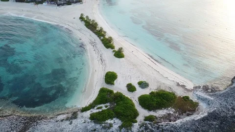 Pan down on rocks at Cove Beach, Bahamas Stock Footage 121720810