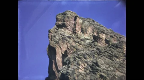 Pan Down Rocky Mountainside Stock Footage 47526440