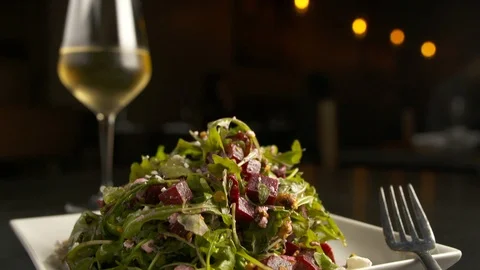 Pan down of salad with wine  Stock Footage 112575852