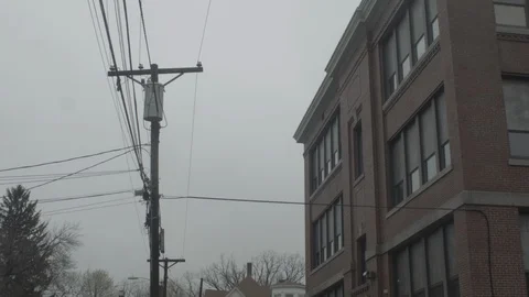 Pan down of school in residential area with houses Stock Footage 90396203