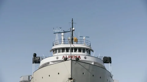 Pan Down Ship moored in Dock in Frozen Lake Stock Footage 89945026