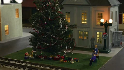 Pan down shot of model train village revealing courthouse and town Christmas Stock Footage 148605533