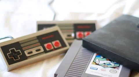 Pan Down Shot of Retro Video Games and Peripherals Stock Footage 49127693