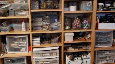 Pan down shot of scrapbook shelf Stock Footage 115213286