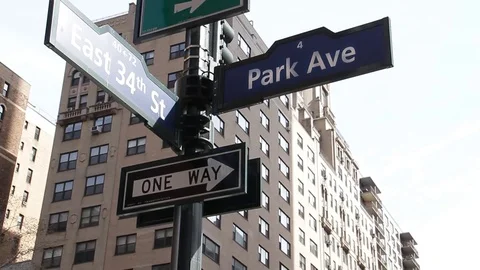 Pan Down from Sign Homesless Man on Park Avenue Stock Footage 73828055