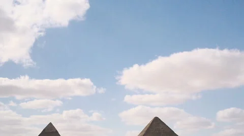 Pan down from sky to Giza Pyramids Stock Footage 49325789