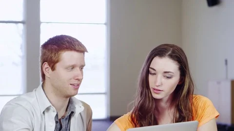 Pan down to students working with laptop Stock Footage 80268416