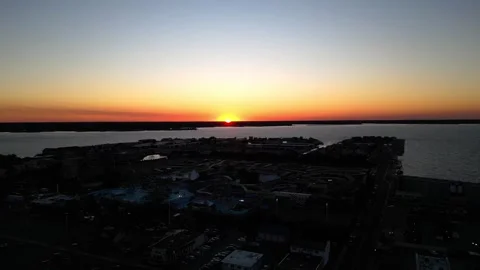 Pan down Sunset over Ocean City Maryland and the Bay Stock Footage 291989384