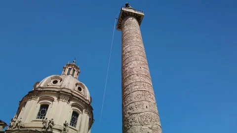 Pan down of Trajans column, one of the major monuments found in the Roman Forum Stock Footage 153979192