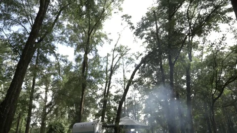 Pan Down of Travel Trailer and Food Cooking on Grill Stock Footage
