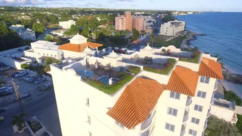 Pan down on white hotel building on tropical island Stock Footage 220539208