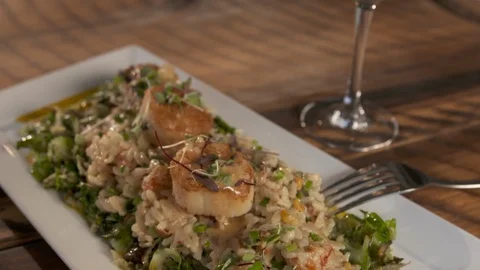 Pan down of white wine to scallops  Stock Footage 112575903