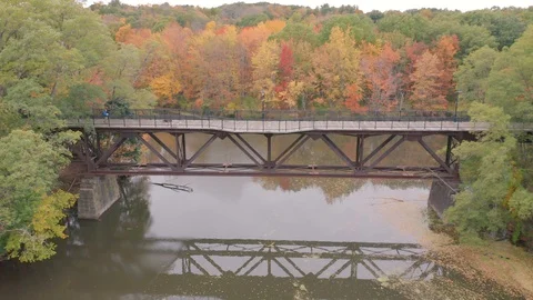 Pan Up Drone Shot Over Walk Bridge In Downtown Dover New Hampshire Video stock 128193828
