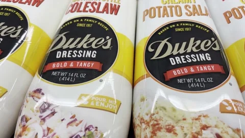 Pan of Dukes Dressing in a squeeze bottle Potato Salad and coleslaw in a gr.. Stock Footage 238388436