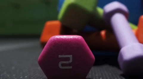 Pan of dumbells on fitness mat Stock Footage 59730157