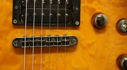 Pan up on electric guitar selective focus Stock Footage 35829772