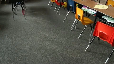 Pan up of empty elementary school classroom 스톡 동영상 21624584