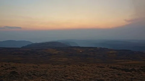 Pan of empty landscape at sunset from summit of Steens Mountain in fall 2 Stock Footage 82022601