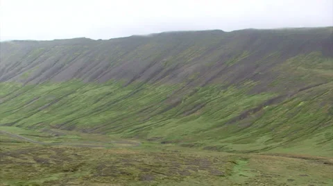 Pan on eroded treeless glacial valley Stock Footage 37279463