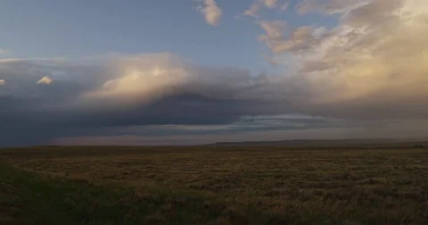Pan of evening storm clouds over prairie Video stock 82280753