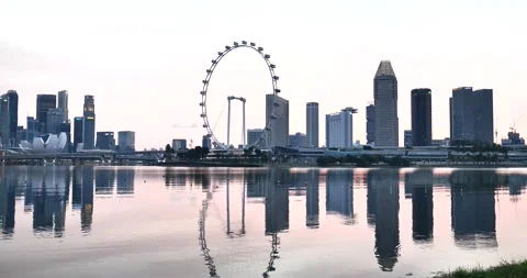 Pan evening view of Flyer wheel Singapore Stock Footage 157542404