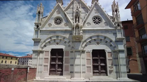 Pan up the facade of the gothic chapel of Santa Maria della Spina, Pisa Stock Footage 157828074