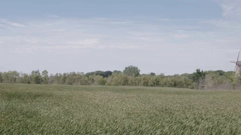 Pan of Field and Windmill Stock Footage 85571825