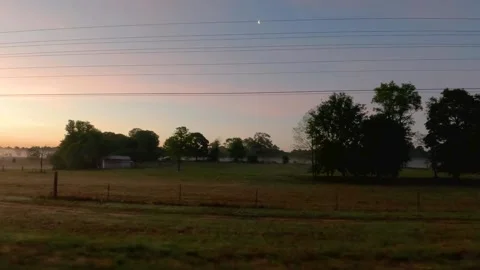 Pan of fog in wheat fields golden hour sunrise farmland country POV Stock-Footage 185202895