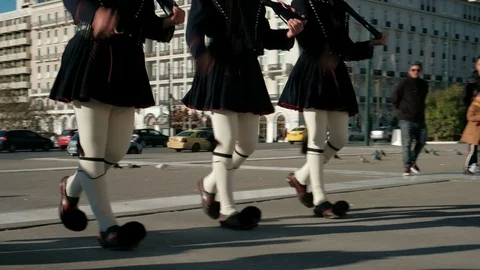 Pan Follow 3 Evzones at Changing Guards Ceremony Tomb Unknown Soldiers in Athens Stock Footage 106481212