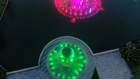 Pan up from a fountain to a river Stock Footage 101950355