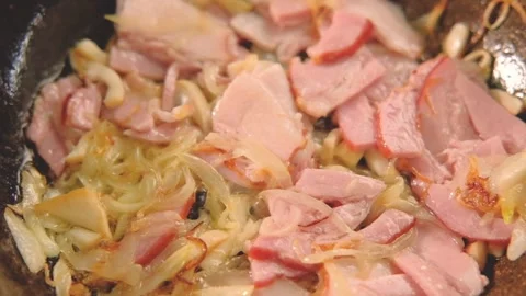 Pan with Fried Bacon. Fry the bacon in a hot pan. Closeup shot in the kitchen. 스톡 동영상 334642322