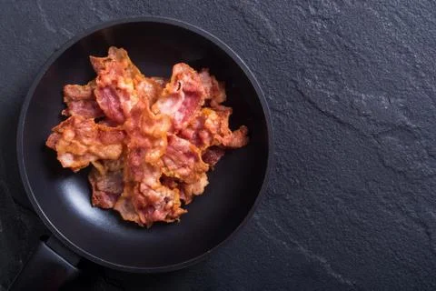 Pan with fried bacon Stock Photos
